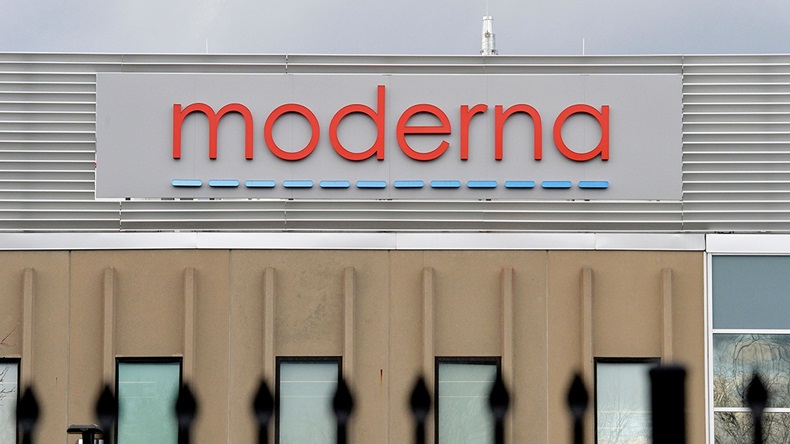 The Moderna logo is seen at the Moderna campus in Norwood, Massachusetts on on December 2, 2020, where the biotechnology company is mass producing its Covid-19 vaccine.