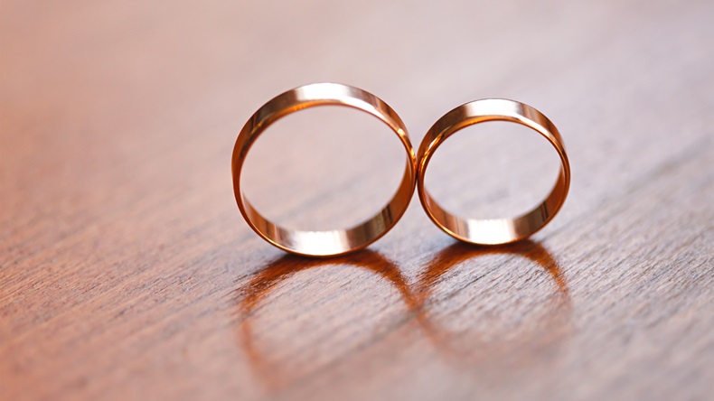 Two wedding rings in infinity sign. Love concept. Very small depth. - Image 
