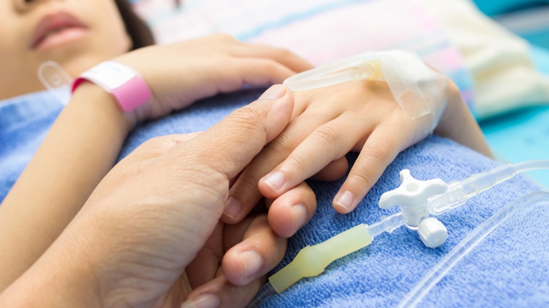 IV solution in a child's patients hand - Image 