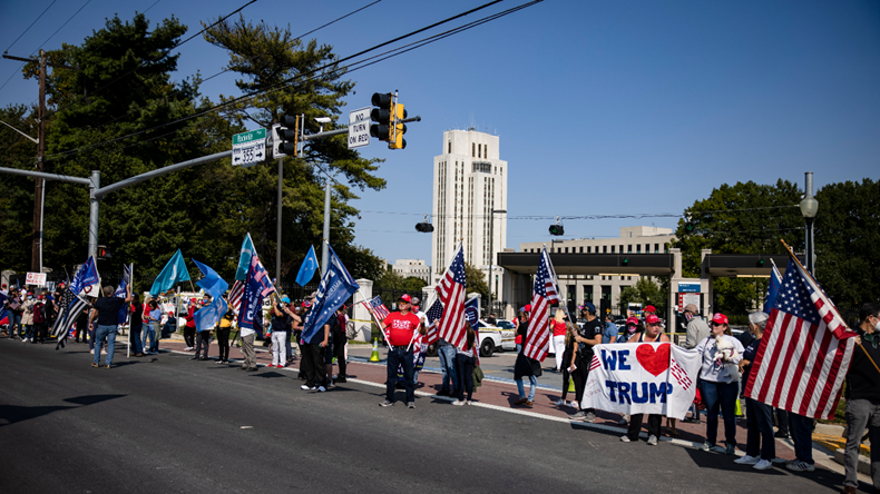 BETHESDA, MD - OCTOBER 04: Supporters of President Donald Trump gather outside of Walter Reed National Military Medical Center after the President was admitted for treatment of COVID-19 on October 4, 2020 in Bethesda, Maryland. The President announced via Twitter early Friday morning that he had tested positive. Numerous other prominent GOP figures and members of Congress have also tested positive in the last few days. (Photo by Samuel Corum/Getty Images)