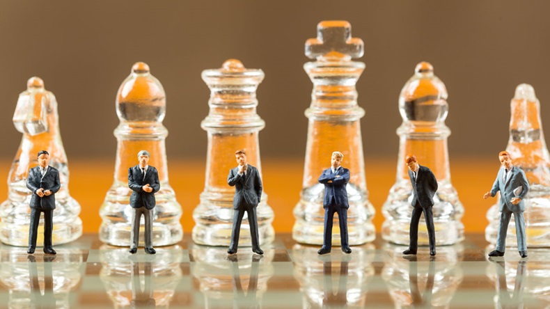 Business men on a Chess board