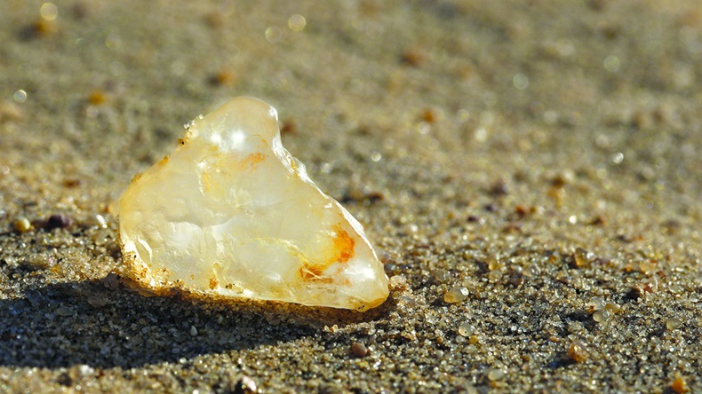 Uncut diamond on the sand