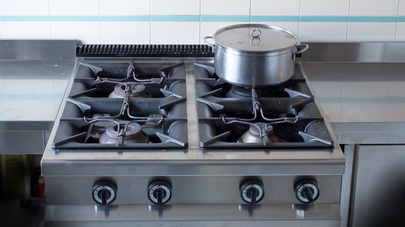 large pot over the stove's gas stainless steel industrial kitchen