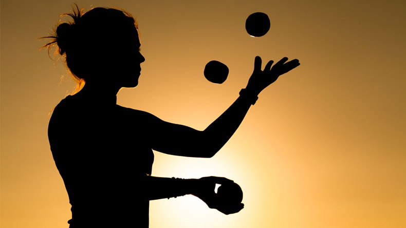 Silhouette of a Woman Juggling with Balls at Sunset - Image 