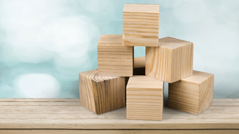 Wooden cubes on table background - Image 