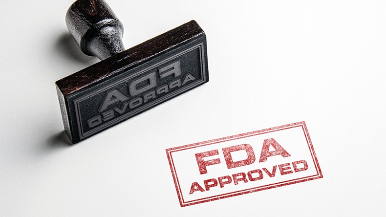 Rubber stamping that says 'FDA Approved'. 