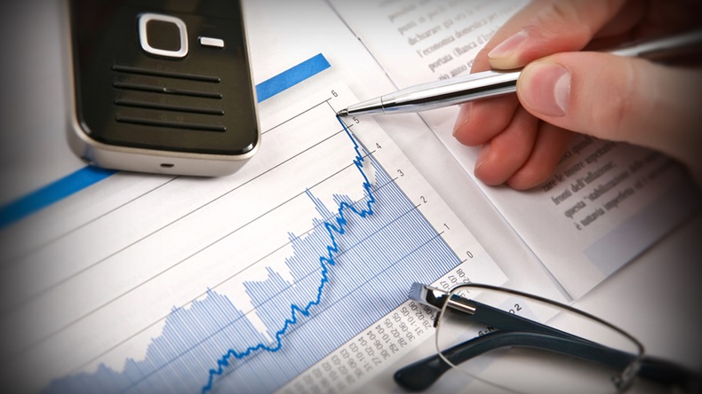 Businessman's hand showing diagram on financial report with pen. Business background 03 - Image 