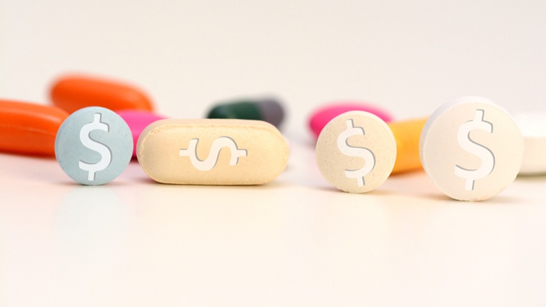 Health care cost concept with multicolored medical drugs with us dollar symbol - Image