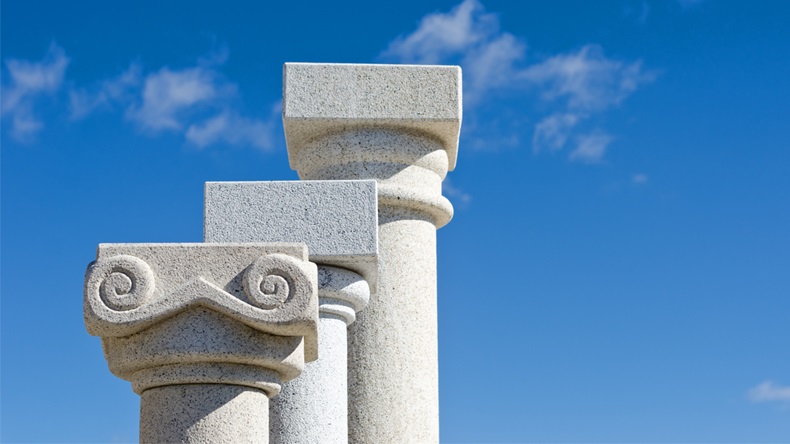 three capitals of granite columns displayed in a shop canteria - Image 