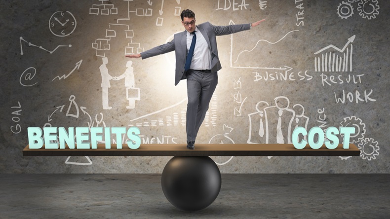 Businessman balancing between cost and benefit in business conce