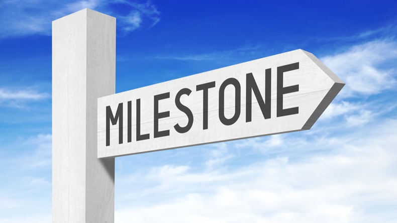 Milestone - white wooden signpost with one arrow