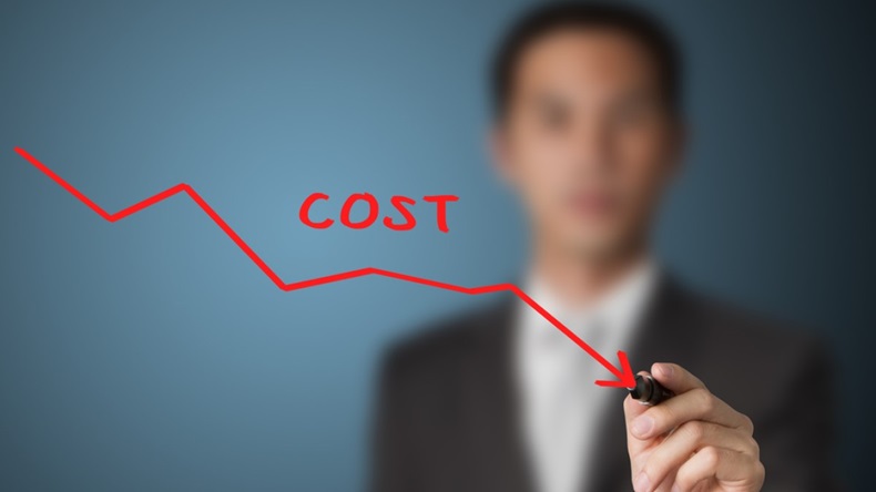 businessman drawing graph of cost reduction
