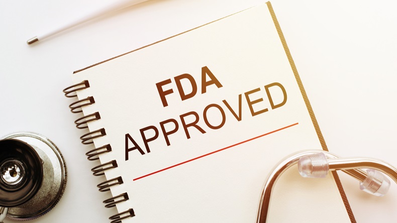 FDA - Food and Drug Administration approved text on document above stethoscope
