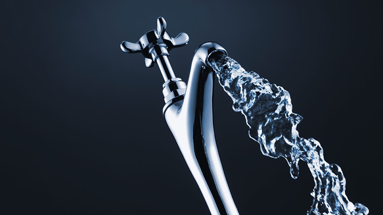 Close up of water pouring from faucet