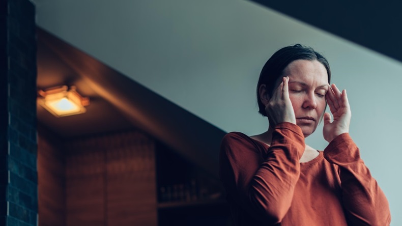 Woman with severe migraine headache