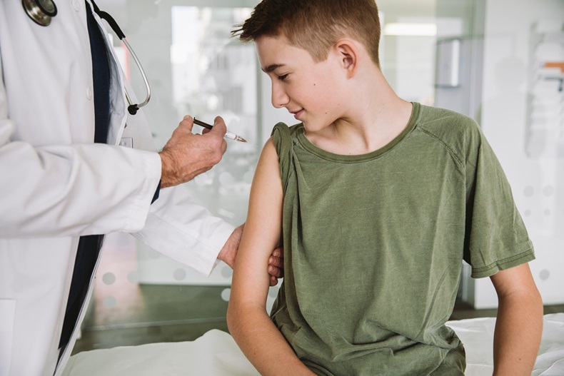 Teenager getting vaccinated