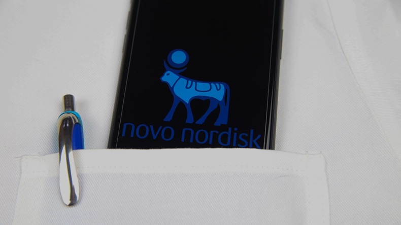 Novo logo on mobile phone screen in doctor coat pocket