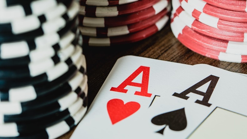 Pair of aces with poker chips