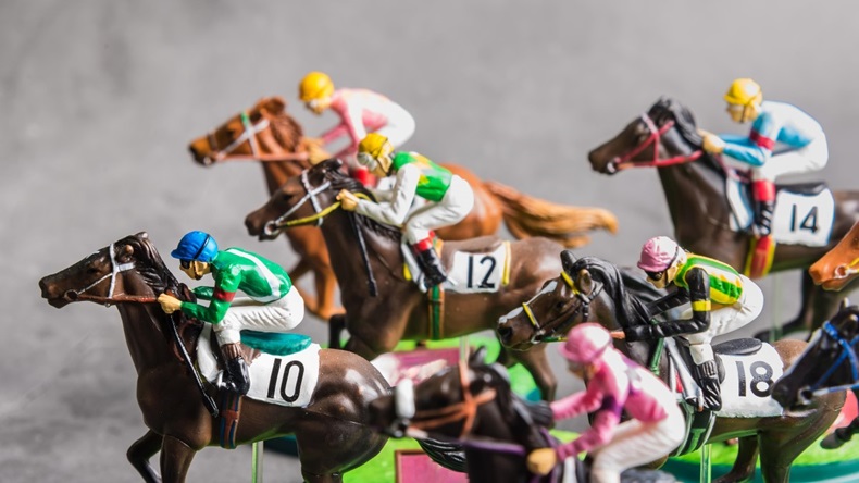 Galloping jockeys and race horse toys competing for position