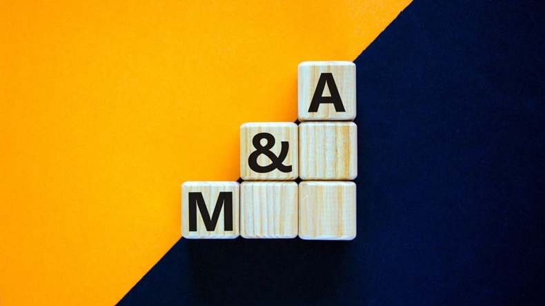 'M and A - mergers and acquisitions' on wooden cubes