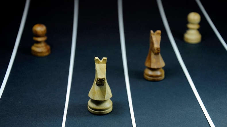 Chess pieces in different lanes, symbolizing a race,
