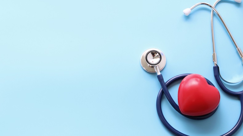 stethoscope and red heart on blue background