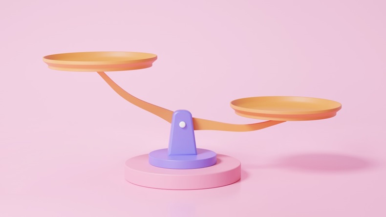 Set of scales on pink background, representing weighing up risks and benefits