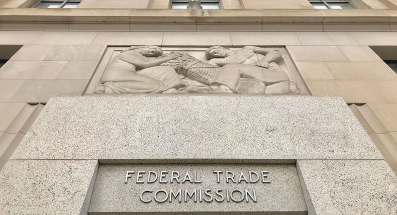 FTC FEDERAL TRADE COMMISSION headquarters building entrance with sign above door and exterior.