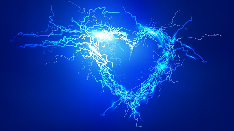 Human's heart. Electric lights effect background.