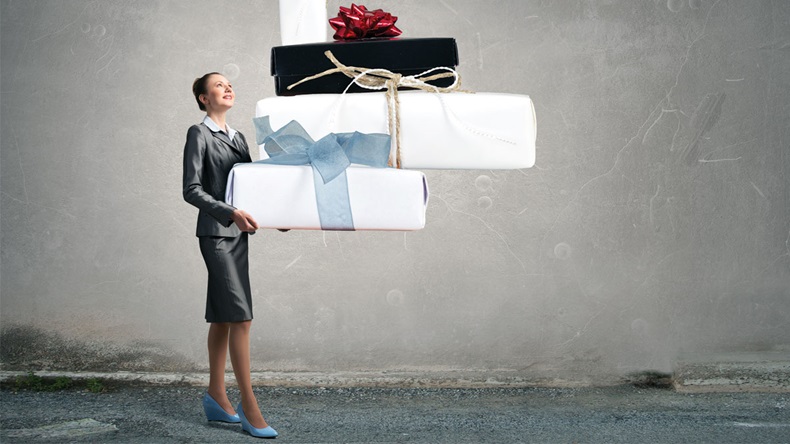 Businesswoman receiving or presenting gifts