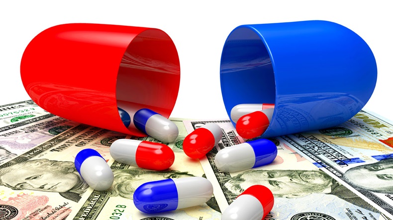 US drug costs: Medical capsules spilled out of an open capsule on dollar bills. High costs of expensive medication concept
