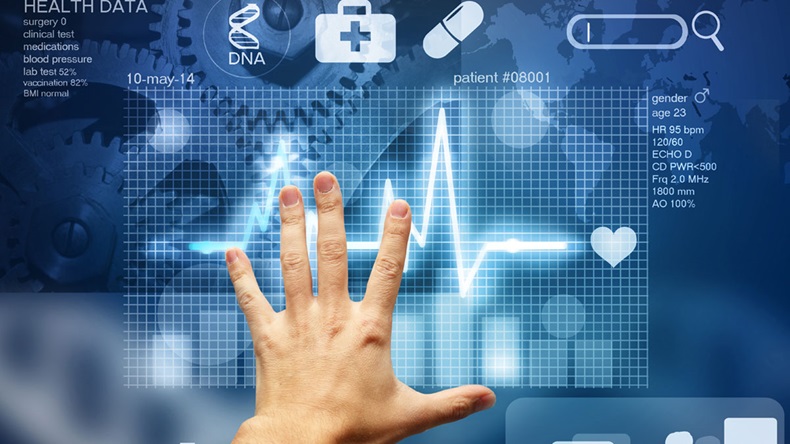 hand touching screen with medical data