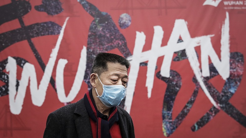 WUHAN, CHINA - JANUARY 22: (CHINA OUT) A man wears a mask while walking in the street on January 22, 2020 in Wuhan, Hubei province, China. A new infectious coronavirus known as "2019-nCoV" was discovered in Wuhan as the number of cases rose to over 400 in mainland China. Health officials stepped up efforts to contain the spread of the pneumonia-like disease which medicals experts confirmed can be passed from human to human. The death toll has reached 17 people as the Wuhan government issued regulations today that residents must wear masks in public places. Cases have been reported in other countries including the United States, Thailand, Japan, Taiwan, and South Korea.